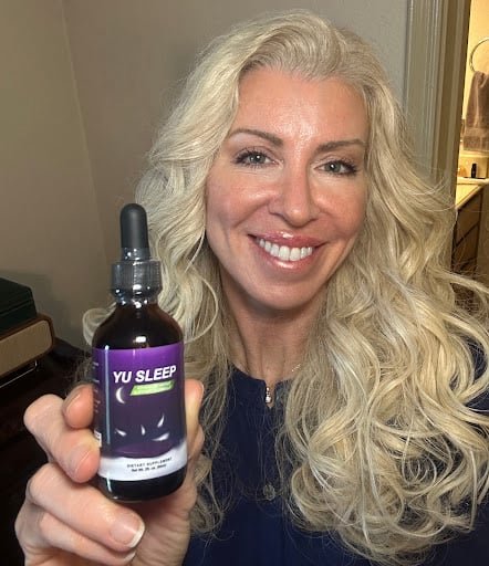 Woman waking up refreshed after using Yu Sleep natural aid